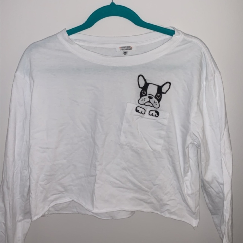 White long sleeve top with frenchie on pocket.